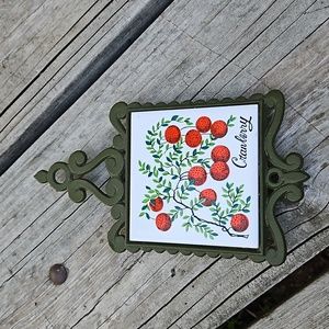 Vintage cast iron and tile Cranberry trivet